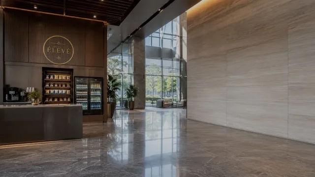 ÉLEVÉ kiosk in a bright building lobby
