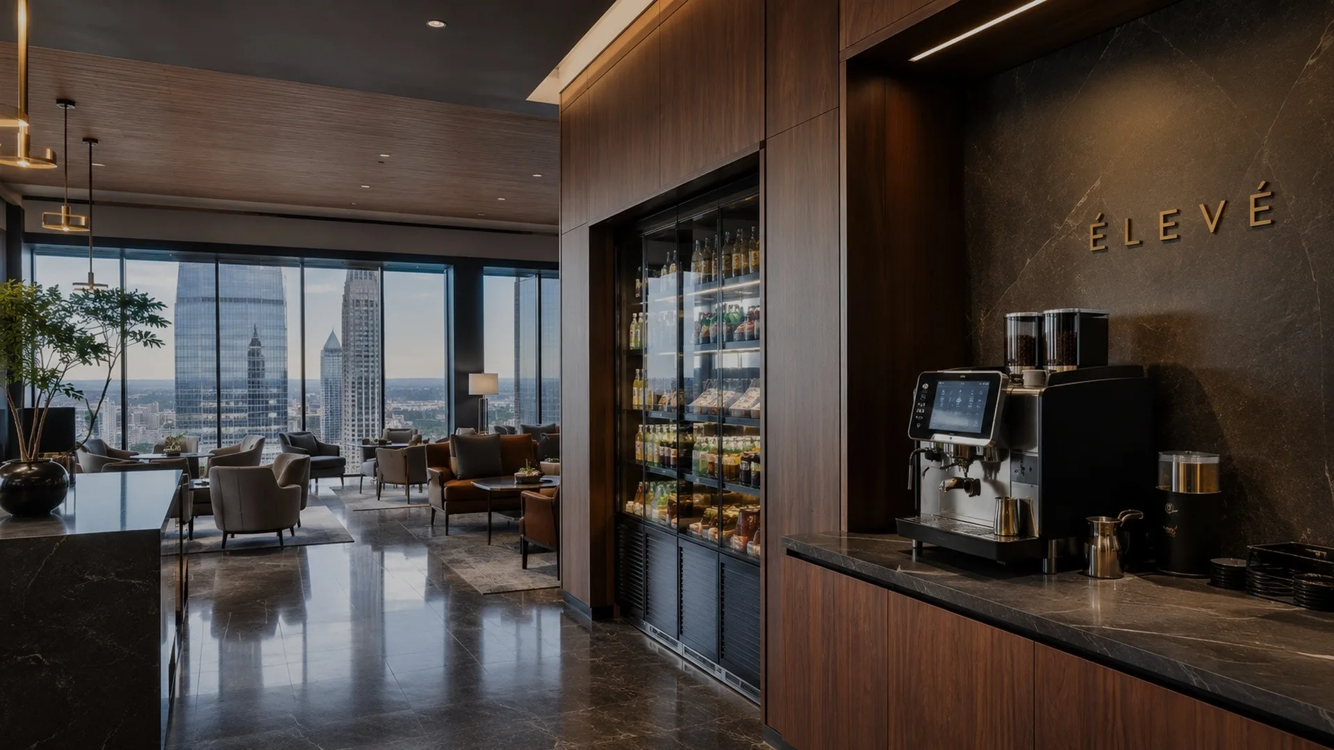 Class A office lounge with skyline views and an ÉLEVÉ coffee amenity